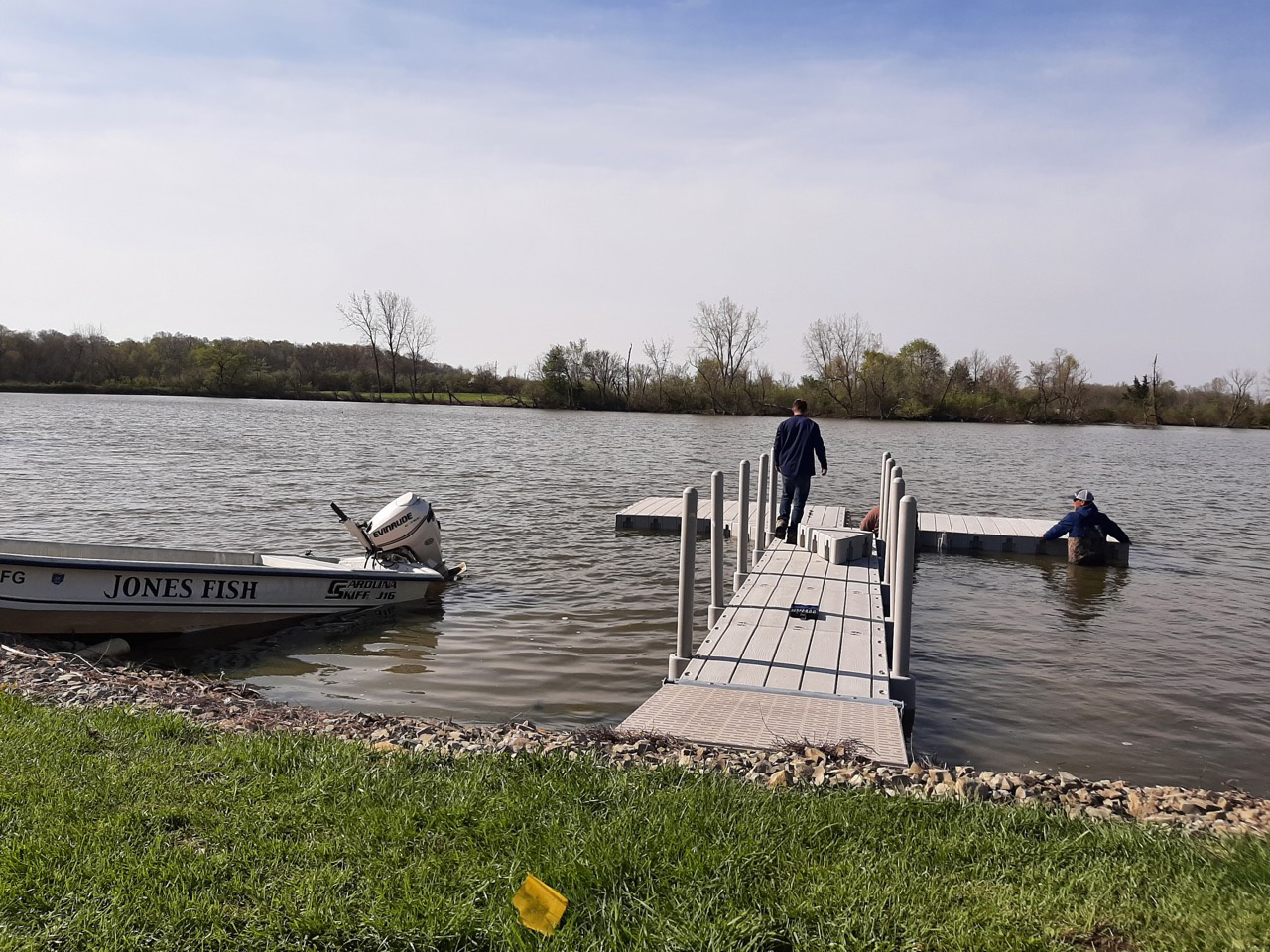 Men installing lake dock