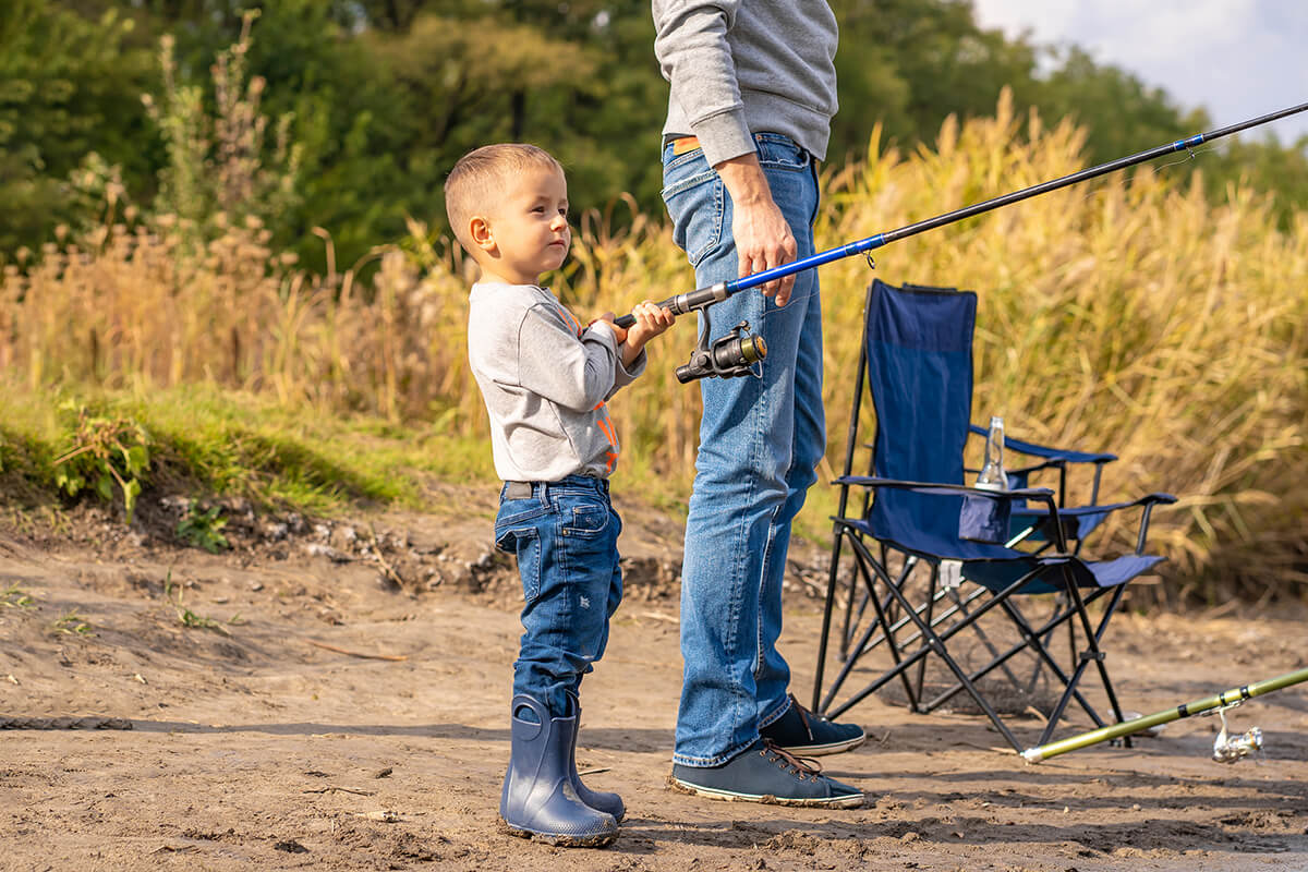Child fishing with adult